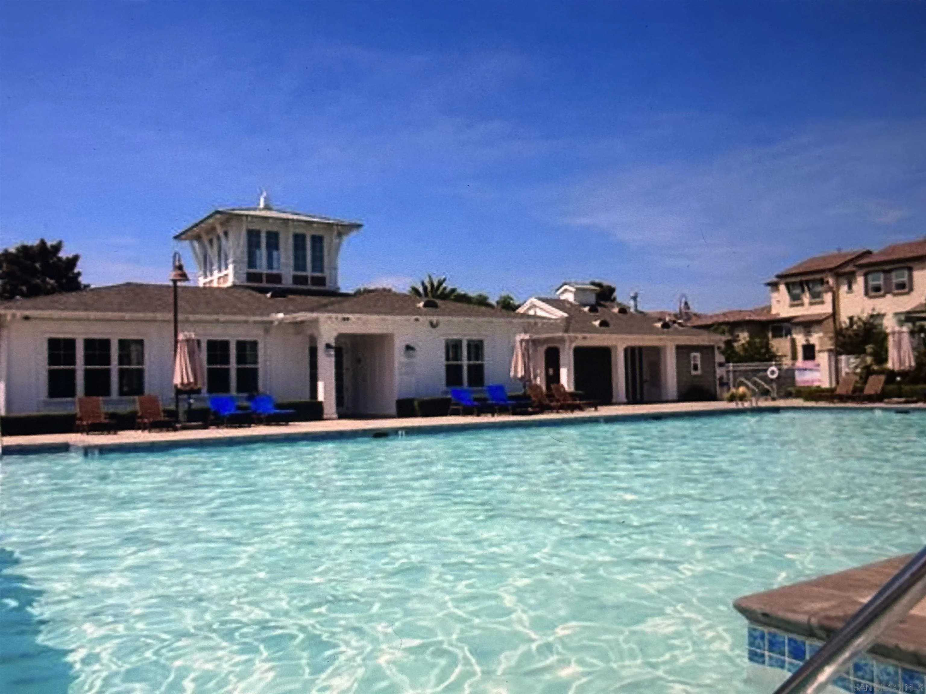 4309 Star Path Way, Unit 2 Oceanside, CA 92056 - Photo 26 of 32 a front view of a house with a yard table and chairs
