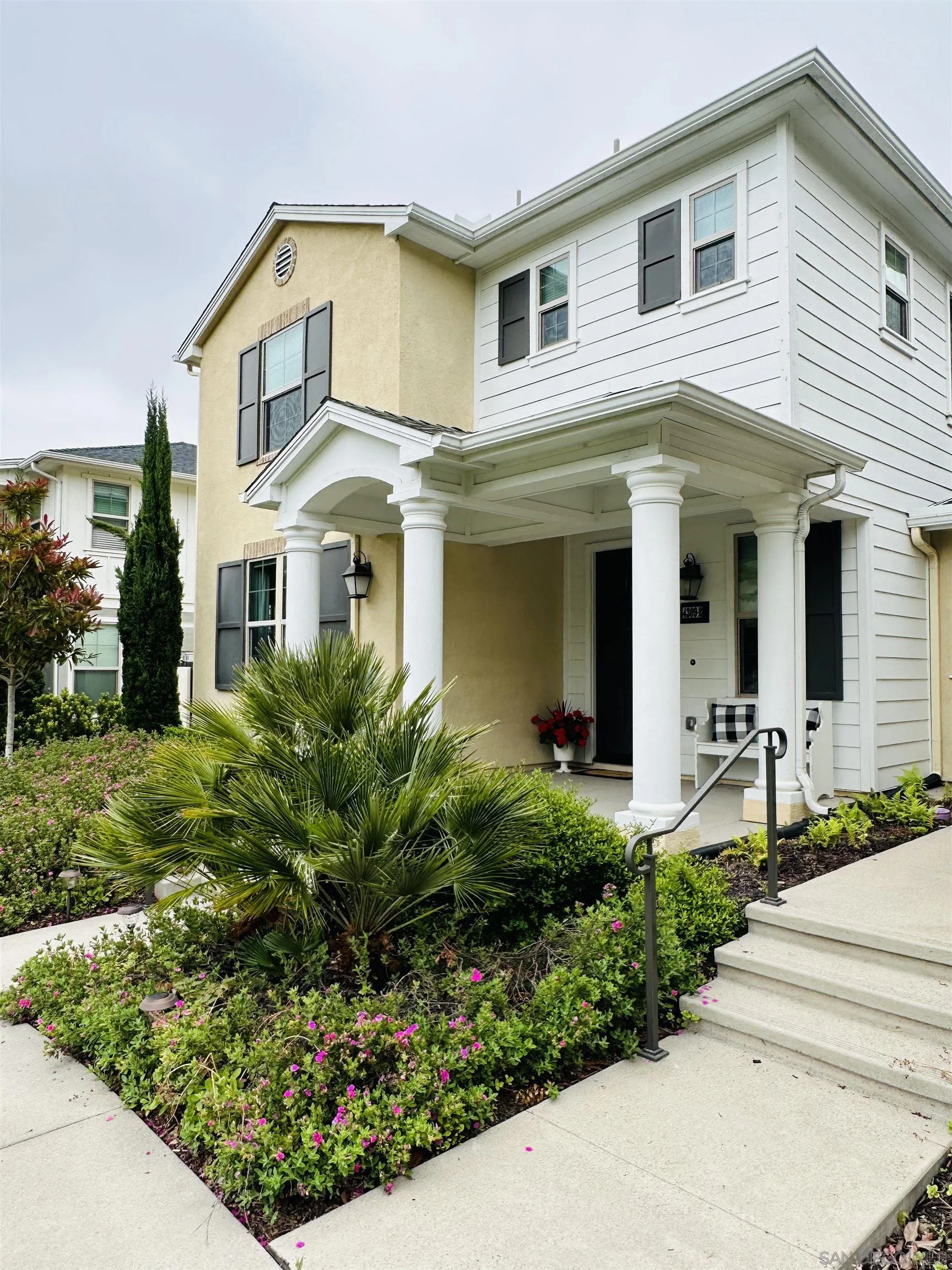 4309 Star Path Way, Unit 2 Oceanside, CA 92056 - Photo 29 of 32 a front view of a house with garden