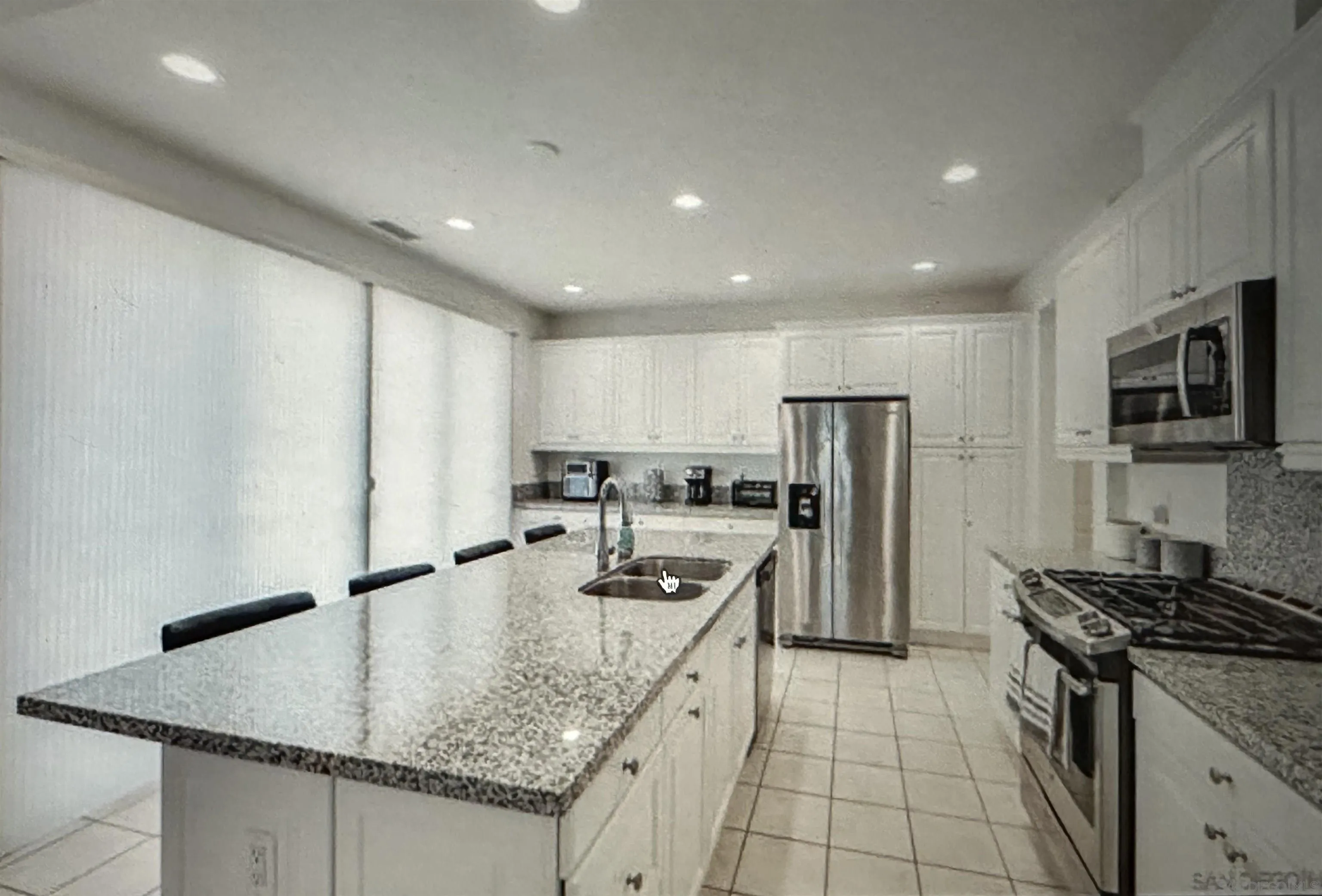 4309 Star Path Way, Unit 2 Oceanside, CA 92056 - Photo 3 of 32 a kitchen with stainless steel appliances granite countertop a sink stove and refrigerator