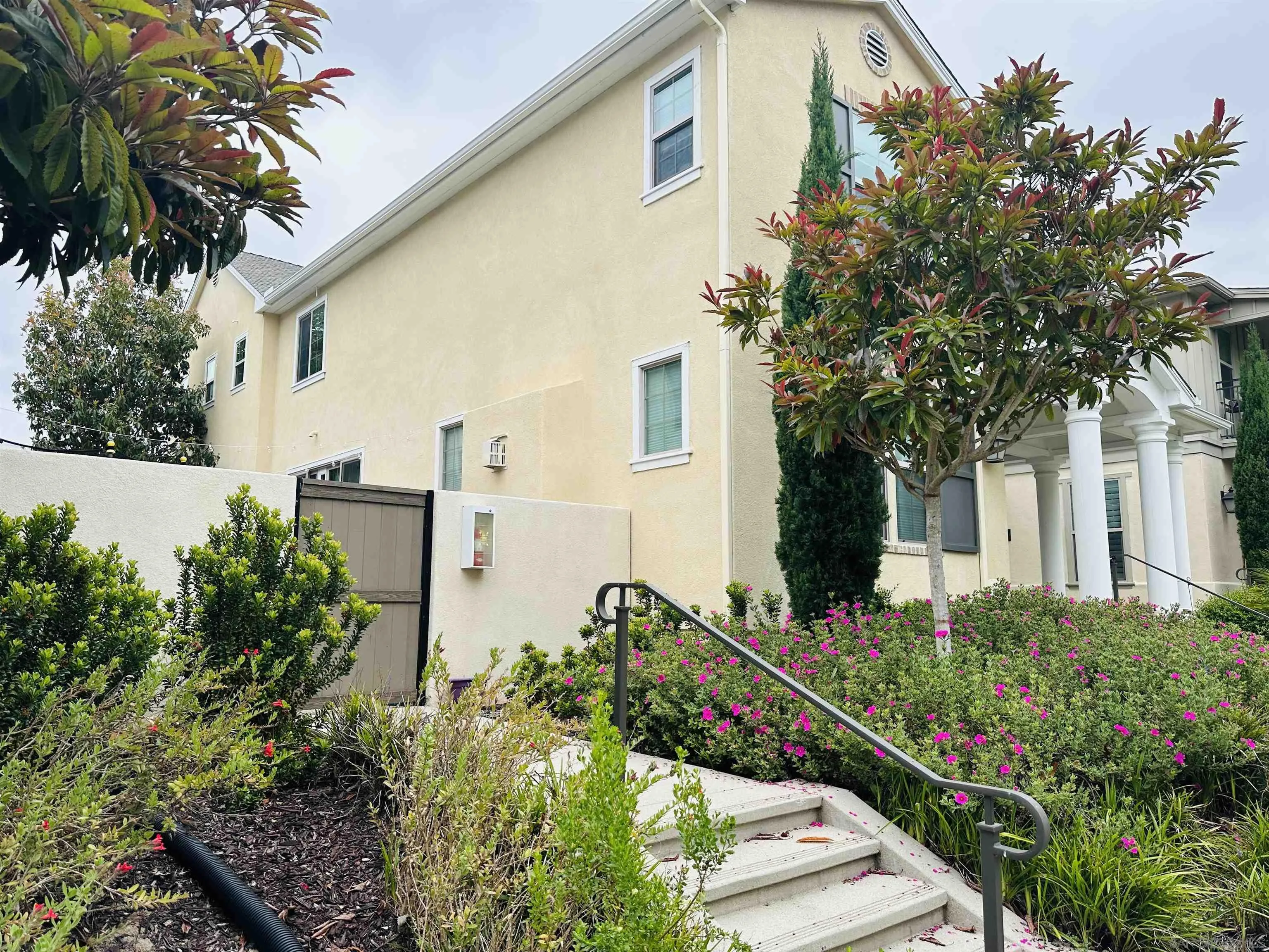 4309 Star Path Way, Unit 2 Oceanside, CA 92056 - Photo 31 of 32 a front view of a house with a yard