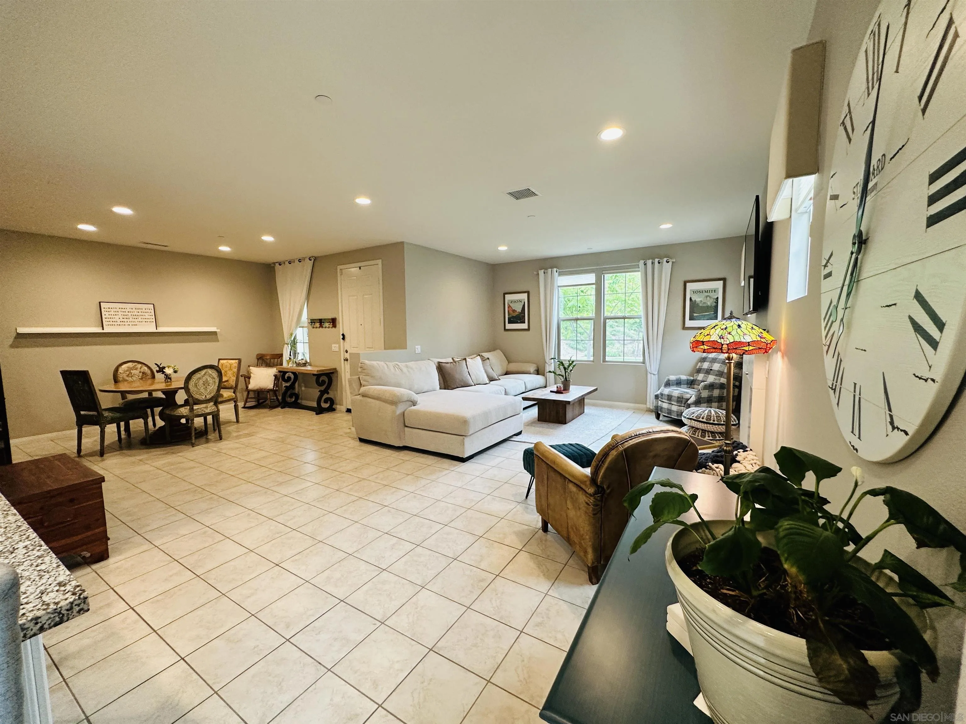 4309 Star Path Way, Unit 2 Oceanside, CA 92056 - Photo 5 of 32 a living room with furniture and a flat screen tv