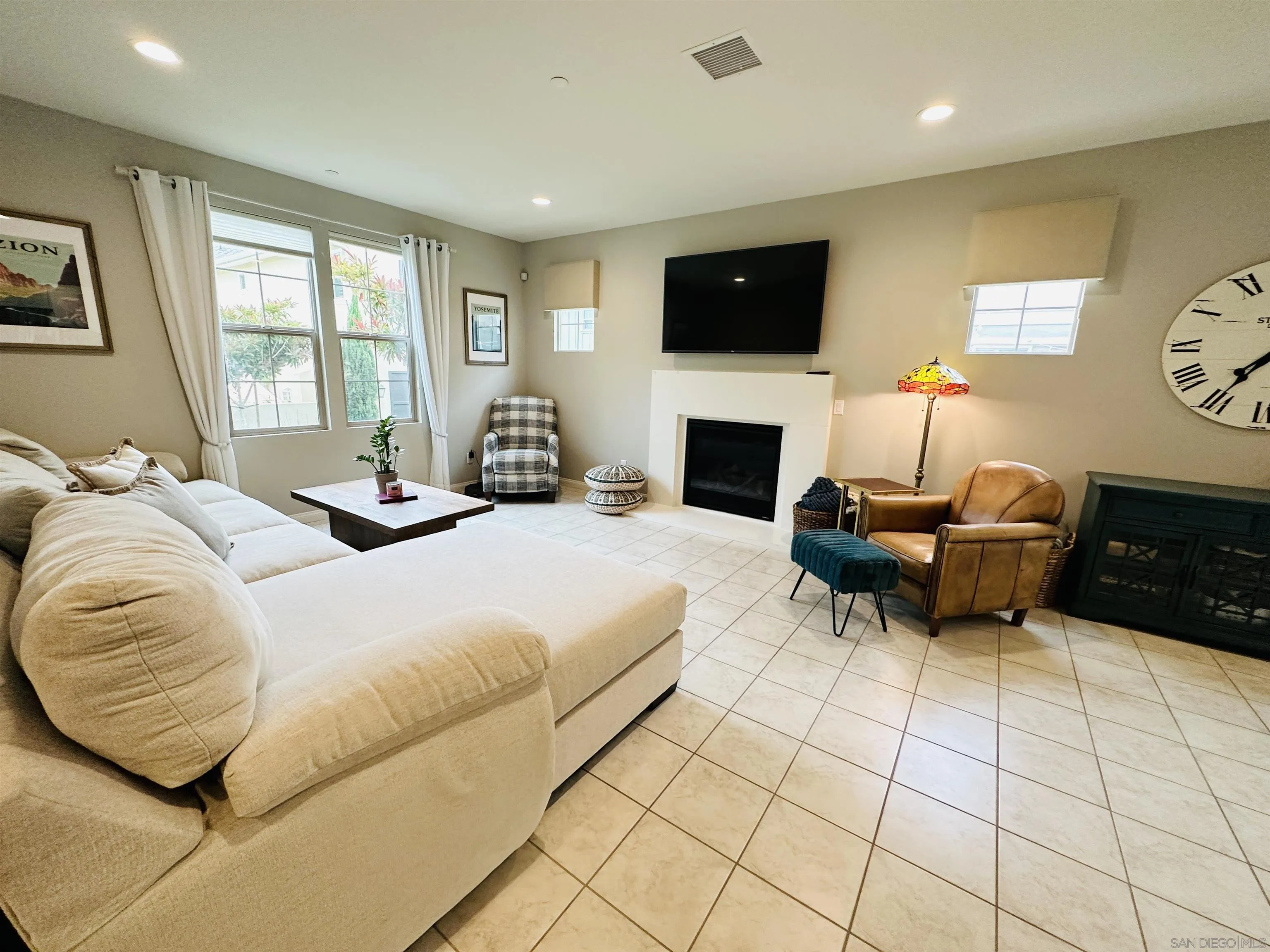 4309 Star Path Way, Unit 2 Oceanside, CA 92056 - Photo 6 of 32 a bedroom with a bed and a fireplace
