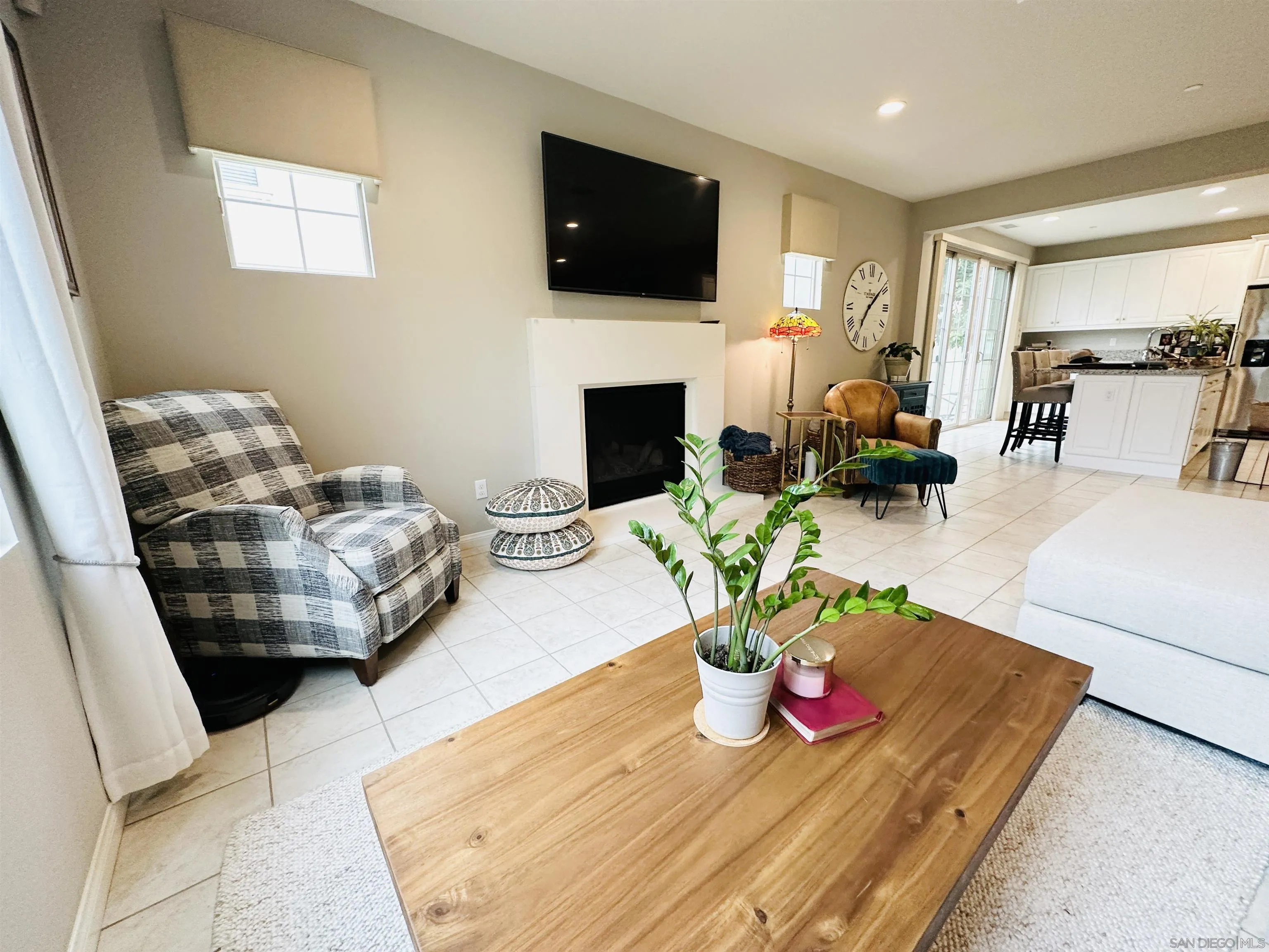 4309 Star Path Way, Unit 2 Oceanside, CA 92056 - Photo 10 of 32 a living room with furniture fireplace and flat screen tv