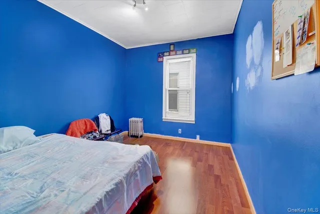 a bedroom with bed and window