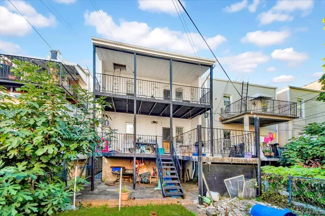 a view of a chairs and table in a patio