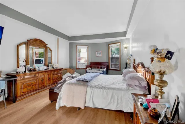 a bed room with a bed and a large mirror