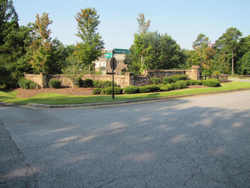 7715 Lynch Road Midland, GA 31820 - Photo 20 of 32 a view of a house with a big yard and large trees