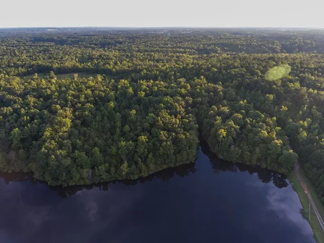 a view of a lake with a yard