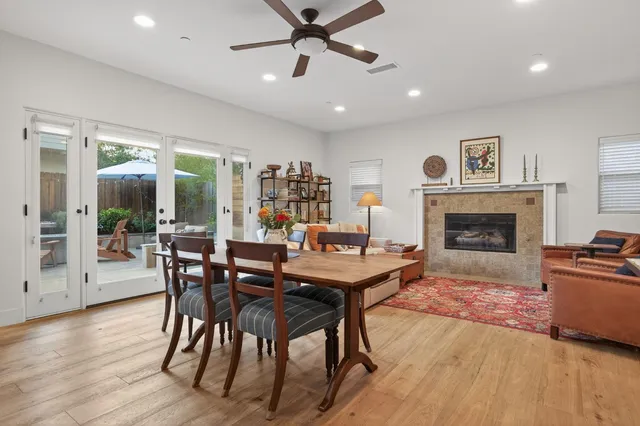 a living room with furniture a window and a fireplace