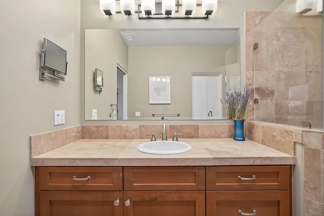 a bathroom with a sink and a mirror