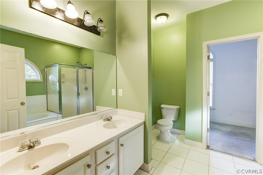 13413 Carters Valley Road Chesterfield, VA 23838 - Photo 14 of 25 a bathroom with a sink and mirror with toilet