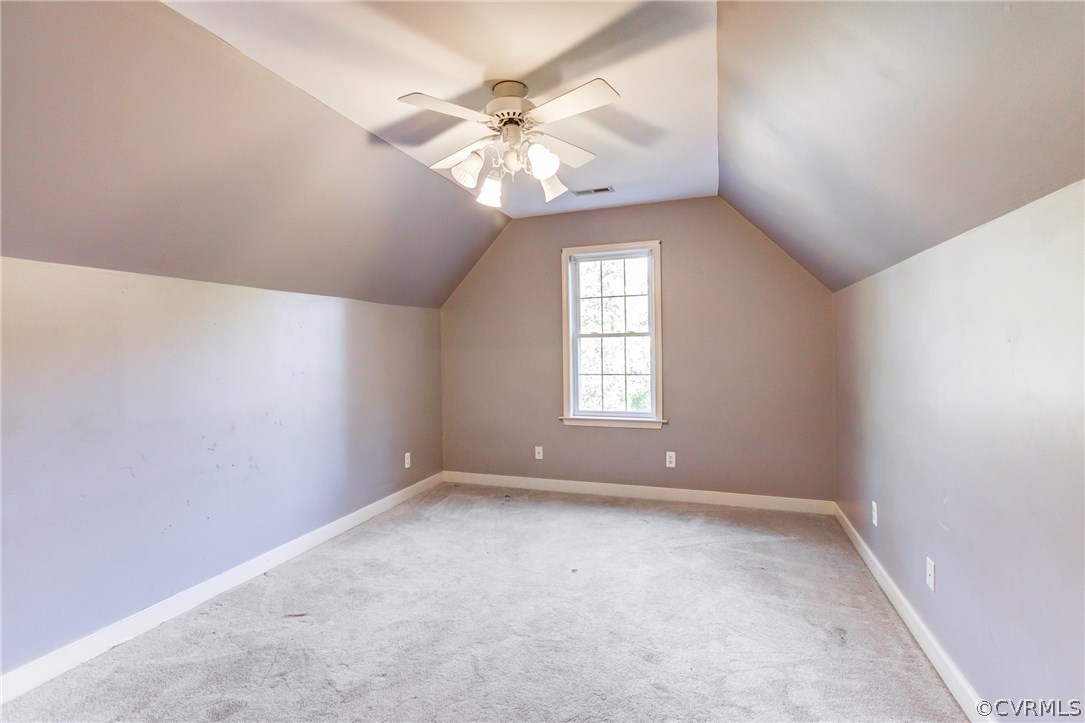 13413 Carters Valley Road Chesterfield, VA 23838 - Photo 16 of 25 an empty room with windows and chandelier fan