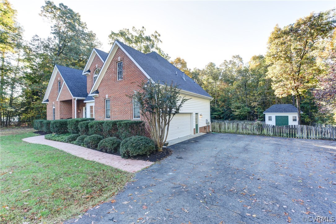13413 Carters Valley Road Chesterfield, VA 23838 - Photo 4 of 25 a view of a house with yard and a tree
