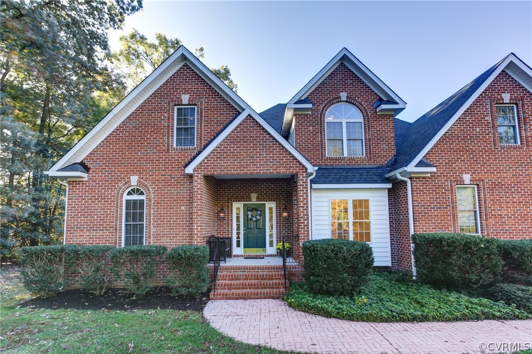 13413 Carters Valley Road Chesterfield, VA 23838 - Photo 5 of 25 a front view of a house with a yard and garage