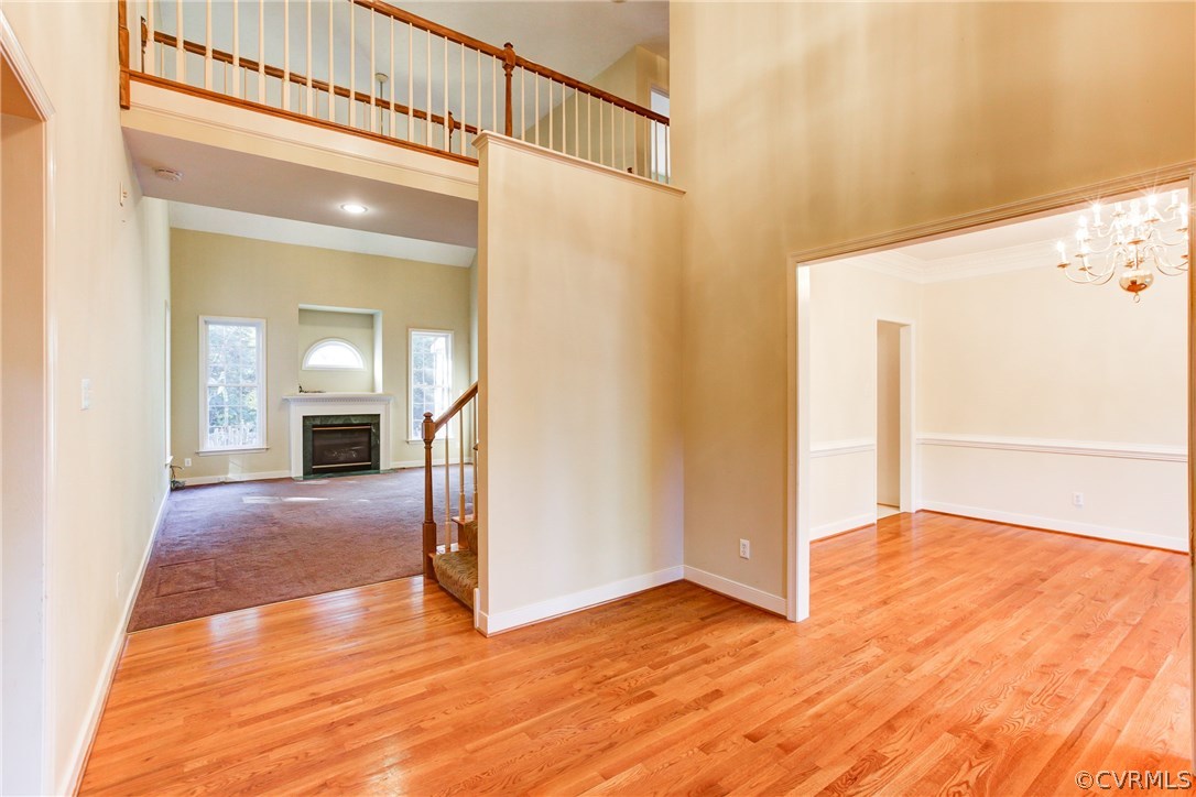 13413 Carters Valley Road Chesterfield, VA 23838 - Photo 6 of 25 a view of a hallway with wooden floor and a living room