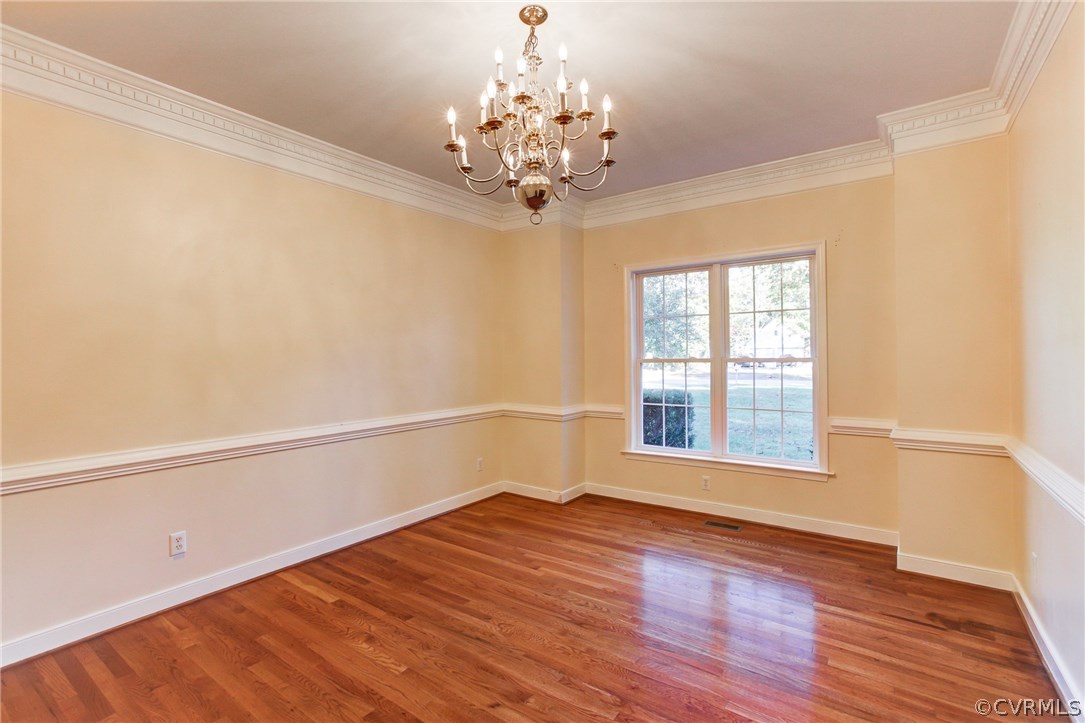 13413 Carters Valley Road Chesterfield, VA 23838 - Photo 7 of 25 a view of an empty room with wooden floor and a window