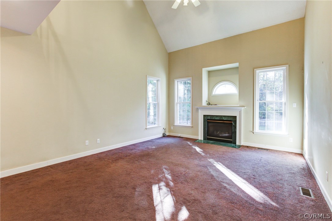 13413 Carters Valley Road Chesterfield, VA 23838 - Photo 9 of 25 a view of an empty room with a fireplace and a window
