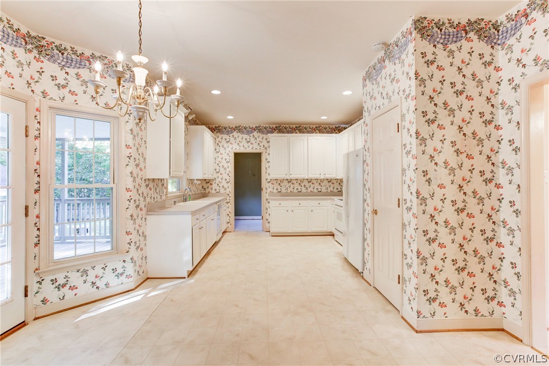 13413 Carters Valley Road Chesterfield, VA 23838 - Photo 10 of 25 a large white kitchen with a large window