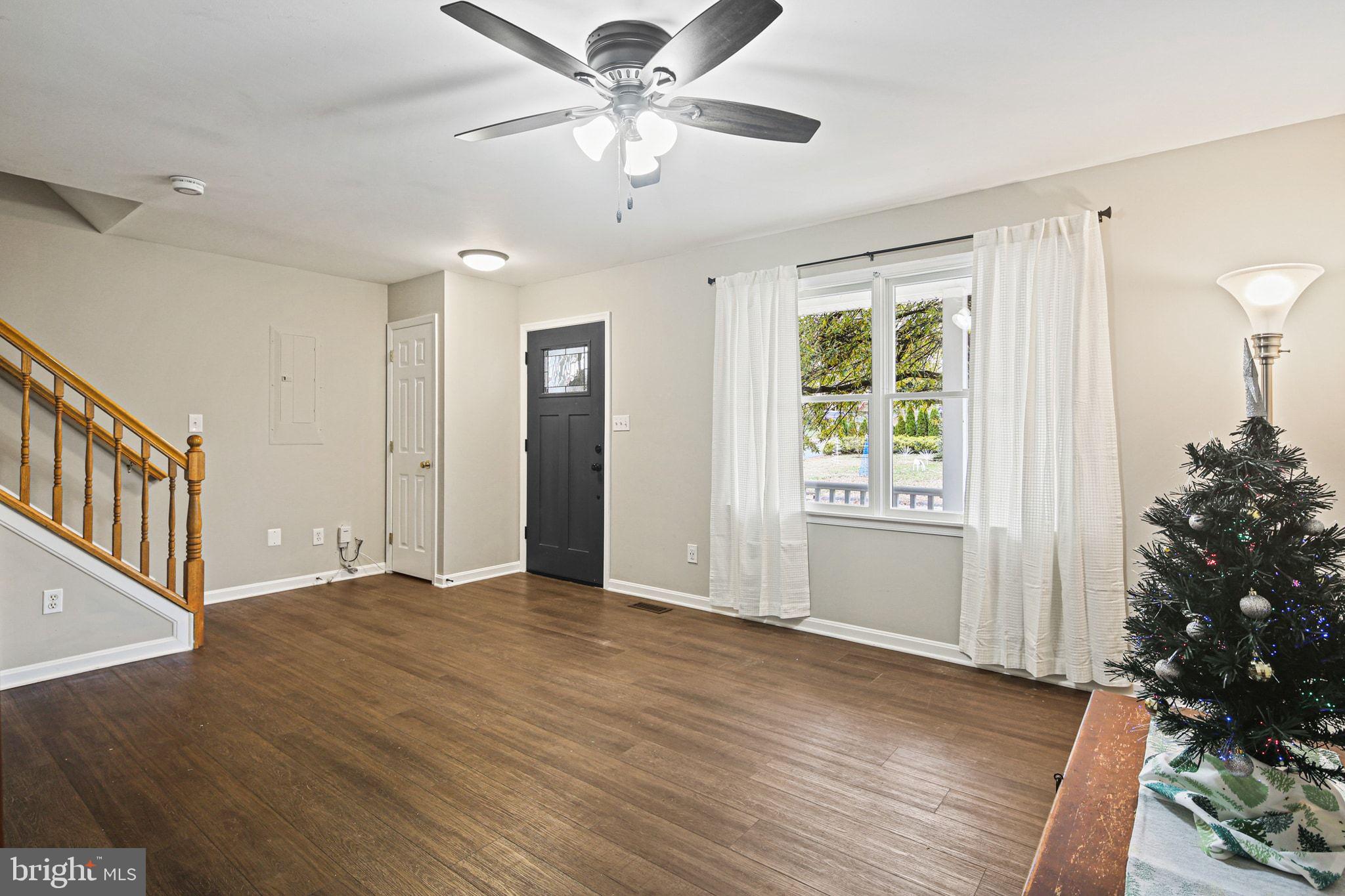 1617 Midland Road Edgewater, MD 21037 - Photo 3 of 41 a view of an empty room with a window and a kitchen