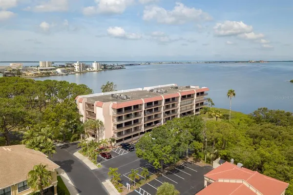 a large buildings with a view of lake