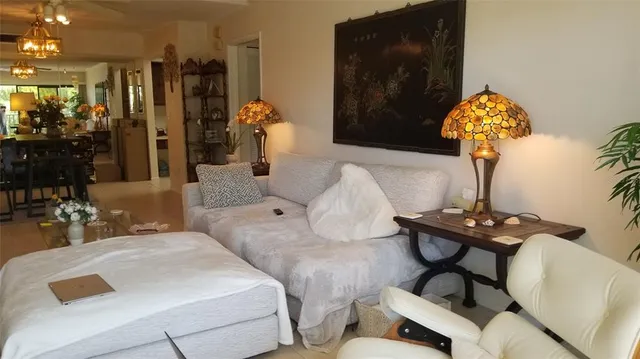 a bedroom with furniture and wooden floor