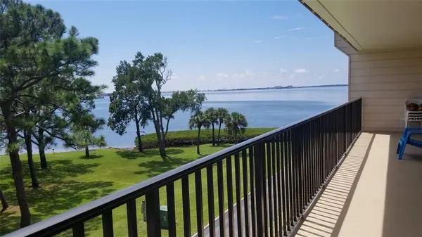 a view of balcony and yard