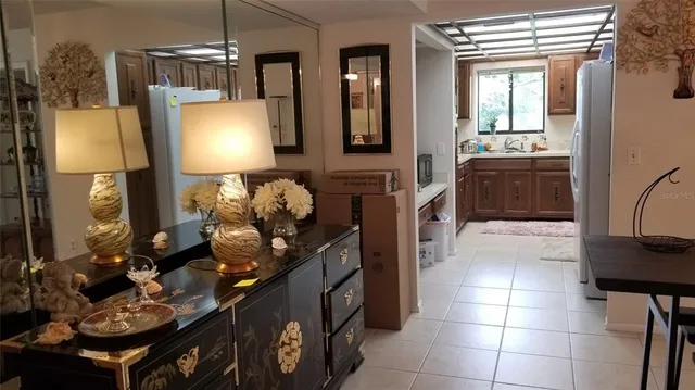 a kitchen with a sink appliances and cabinets