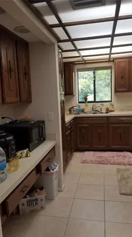 a kitchen with a sink and cabinets
