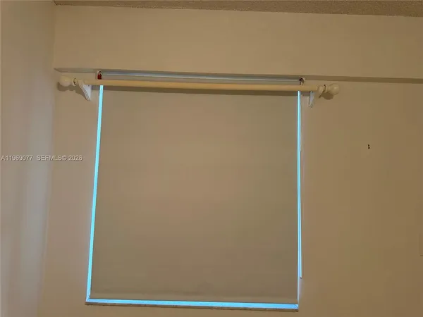 a view of wooden floor and a door