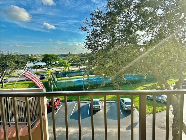 a view of a balcony with wooden floor
