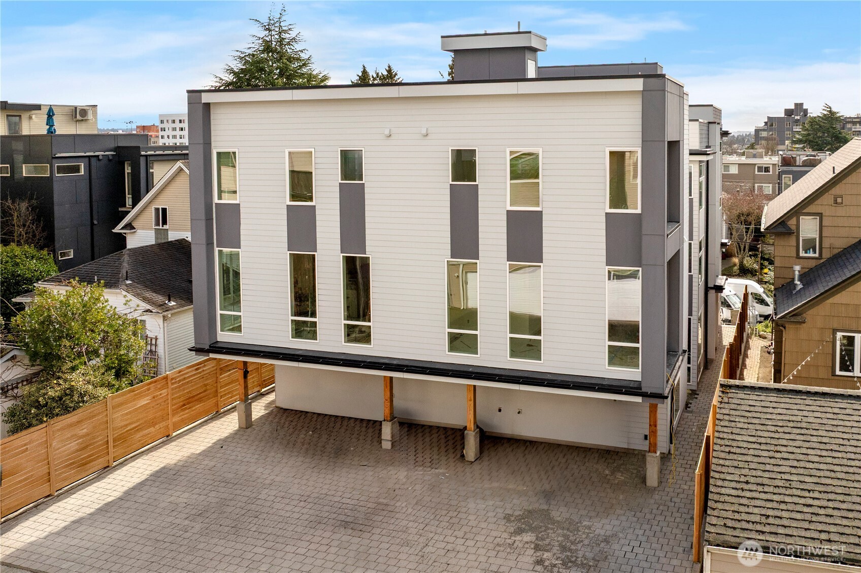 2230 Northwest 60th Street Seattle, WA 98107 - Photo 7 of 14 a view of a blue house with large windows