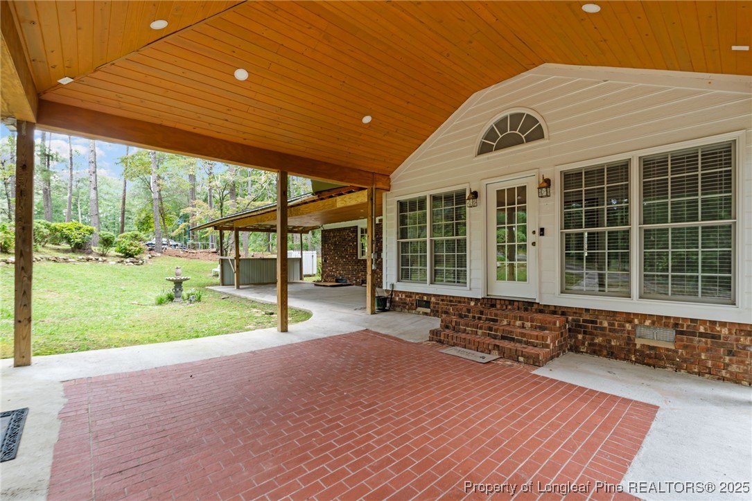 610 Maynard Lake Road Erwin, NC 28339 - Photo 41 of 49 a view of a house with backyard and porch