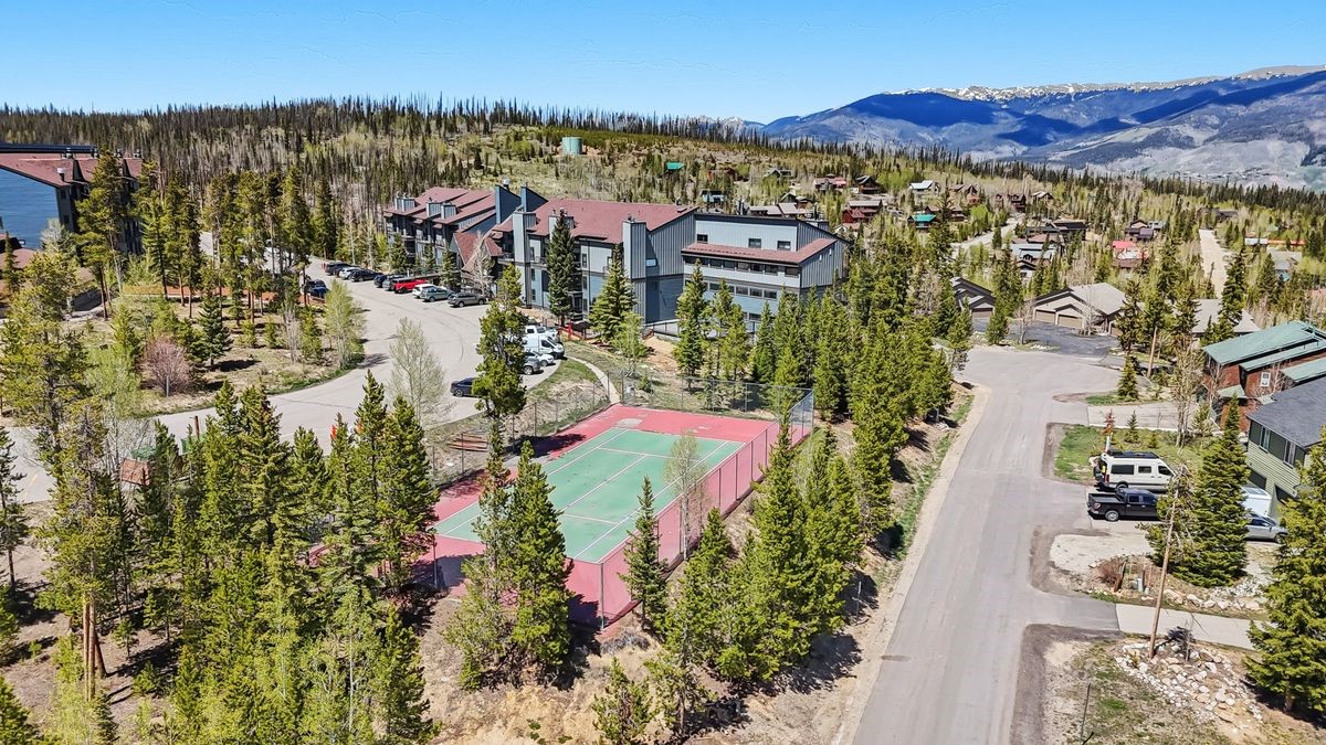 89410 Ryan Gulch Road, Unit 208 Silverthorne, CO 80498 - Photo 26 of 30 a view of a city with mountains in the background