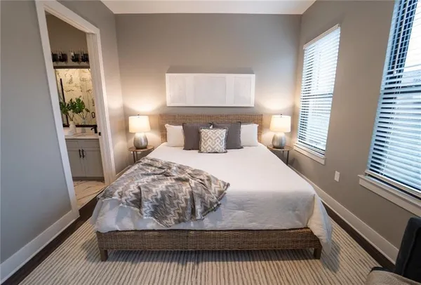 a bedroom with a bed and window