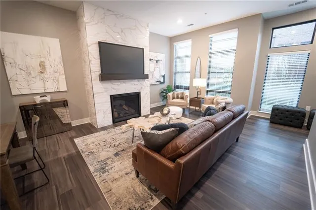 a living room with furniture and a fireplace