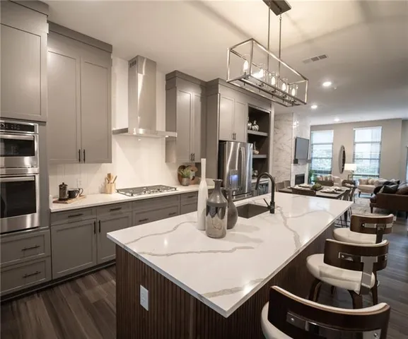 a kitchen with a dining table and chairs
