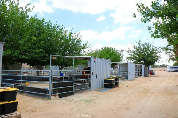a view of backyard with swimming pool and outdoor seating