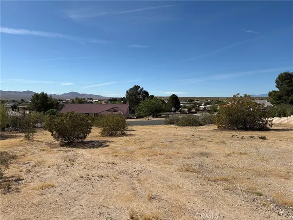 a view of ocean beach and mountain
