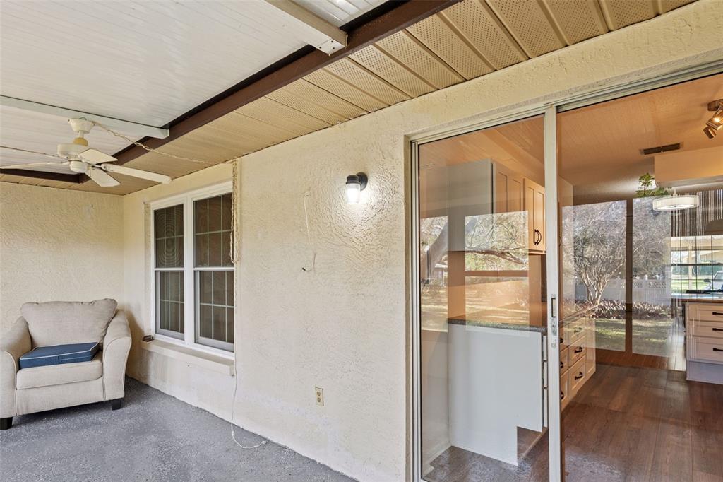 1114 Castlemay Circle Dunedin, FL 34698 - Photo 20 of 21 a view of a hallway with furniture and a window