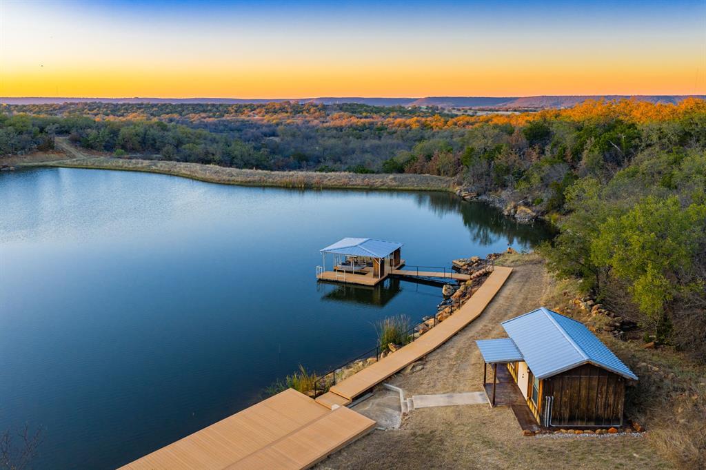 770 Sand Lane Santo, TX 76472 - Photo 18 of 40 a view of a lake with a mountain