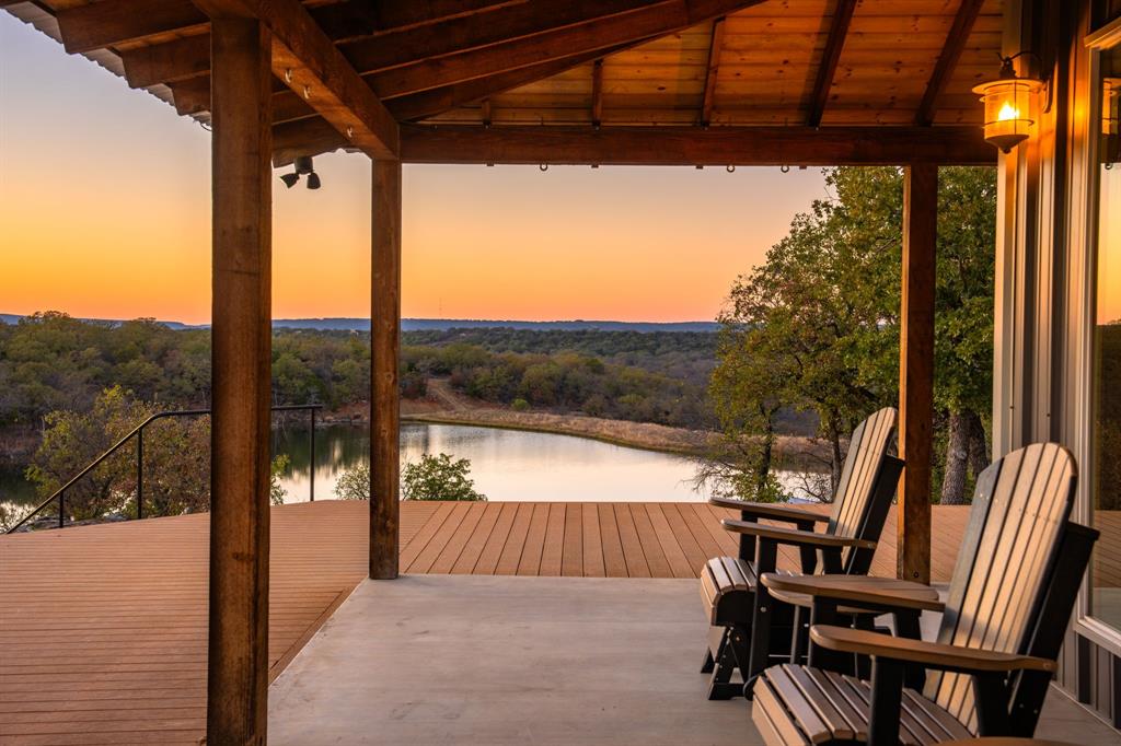 770 Sand Lane Santo, TX 76472 - Photo 30 of 40 a view of porch with furniture and a yard