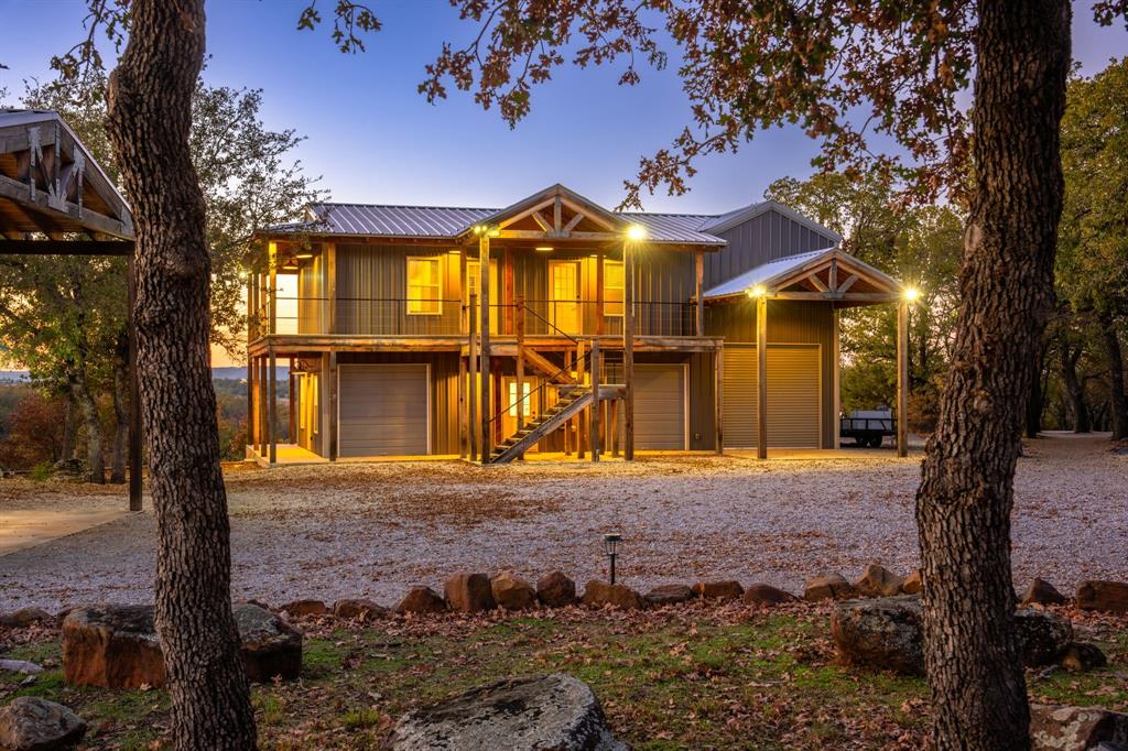 770 Sand Lane Santo, TX 76472 - Photo 31 of 40 a front view of a house with a yard