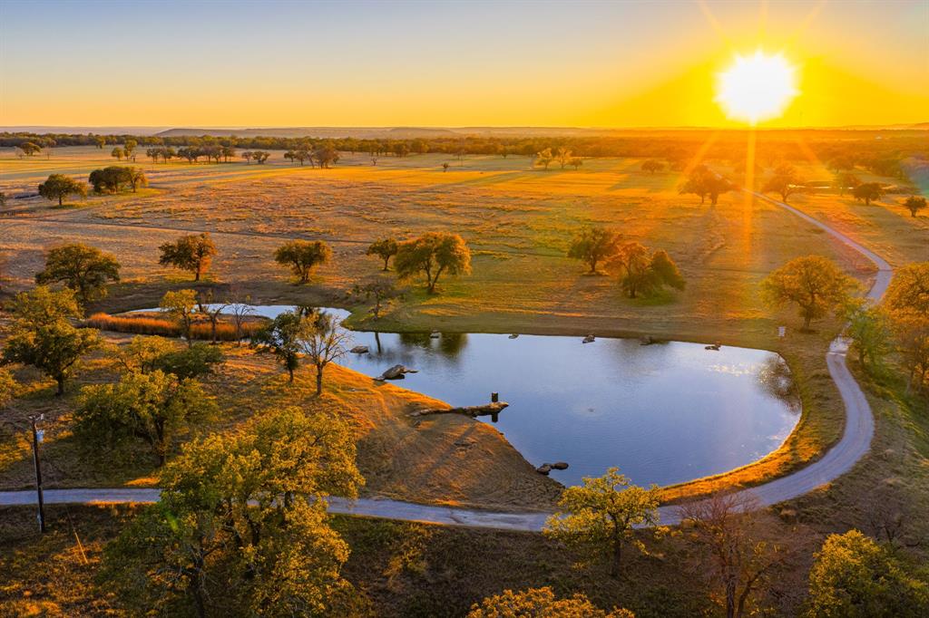770 Sand Lane Santo, TX 76472 - Photo 4 of 40 an aerial view of ocean residential house with outdoor space
