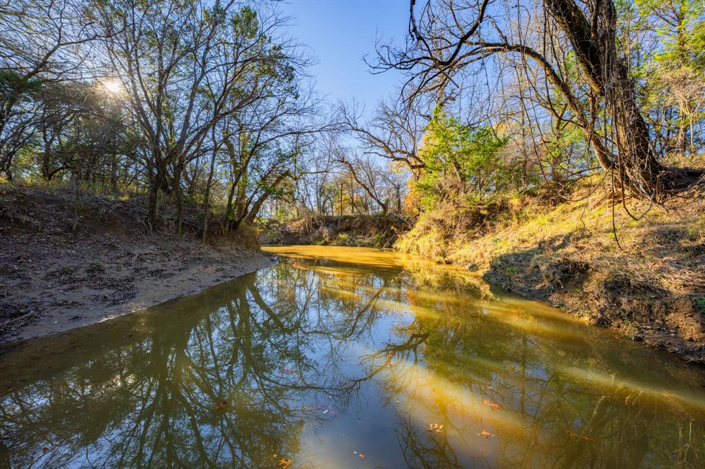 770 Sand Lane Santo, TX 76472 - Photo 10 of 40 a view of swimming pool from a lake view