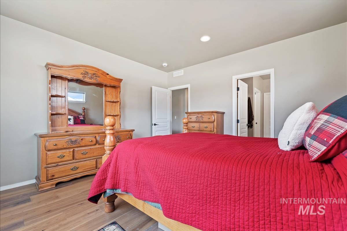6308 South Kelso Way Boise, ID 83709 - Photo 19 of 35 Bedroom featuring wood finished floors and recessed lighting