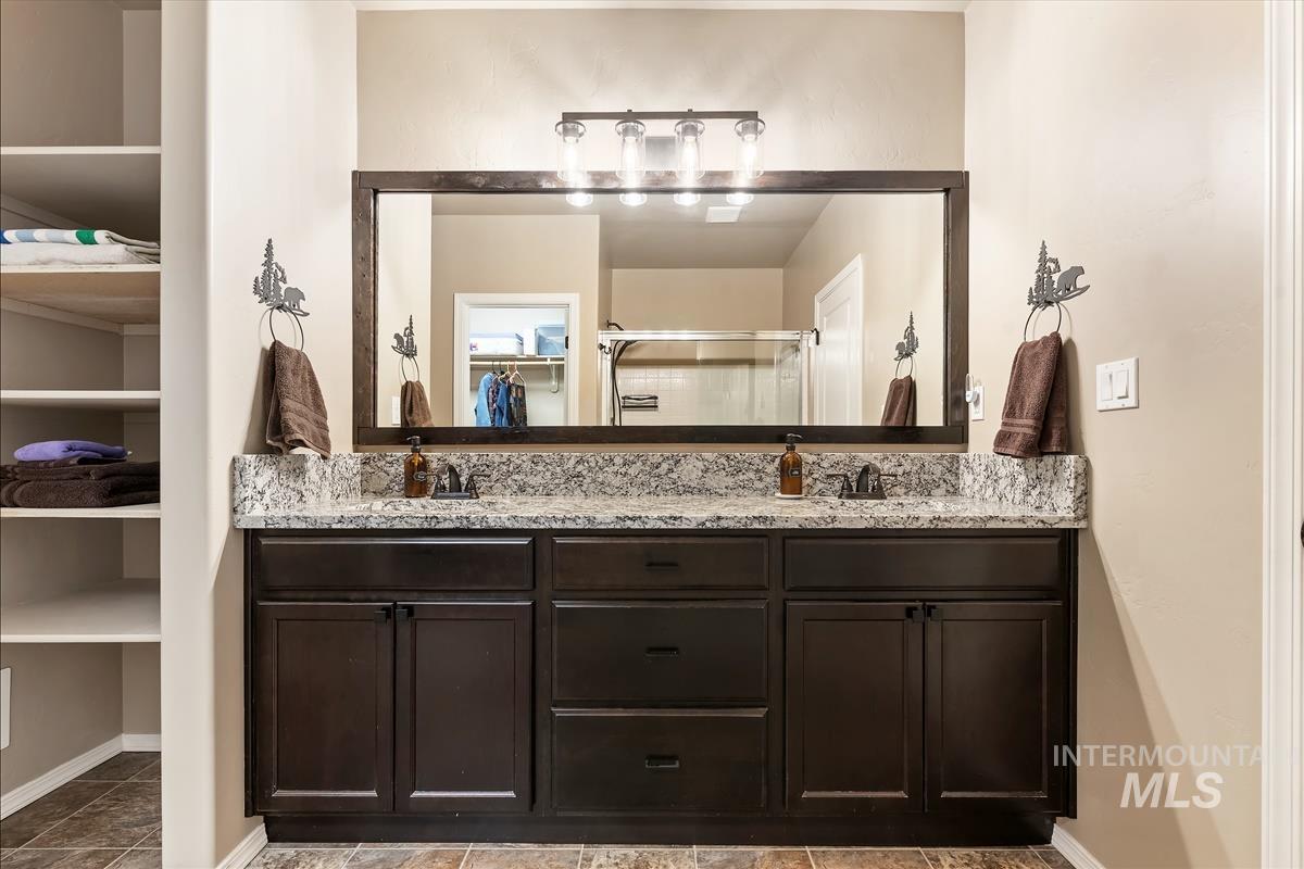 6308 South Kelso Way Boise, ID 83709 - Photo 21 of 35 Full bathroom with double vanity and a walk in closet