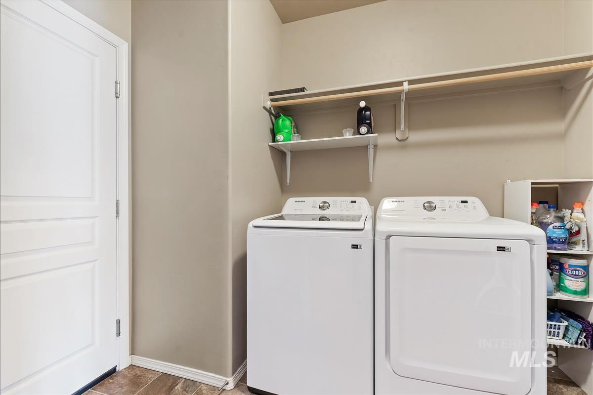 6308 South Kelso Way Boise, ID 83709 - Photo 24 of 35 Laundry area with washer and dryer and baseboards