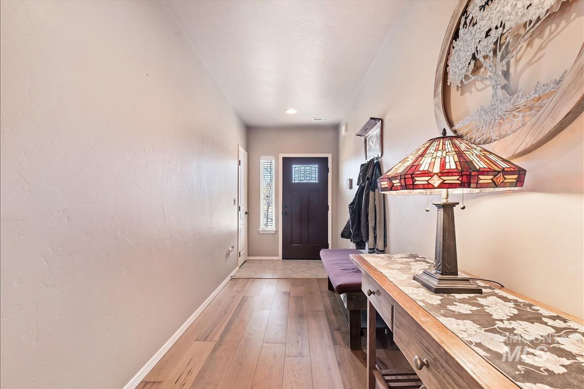 6308 South Kelso Way Boise, ID 83709 - Photo 3 of 35 Entryway with baseboards and light wood-style floors