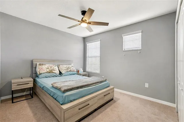 a bedroom with a bed and window