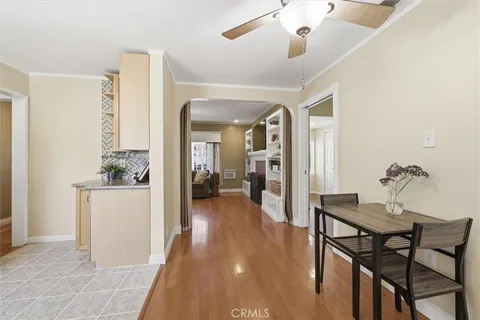 a dining room with furniture and wooden floor